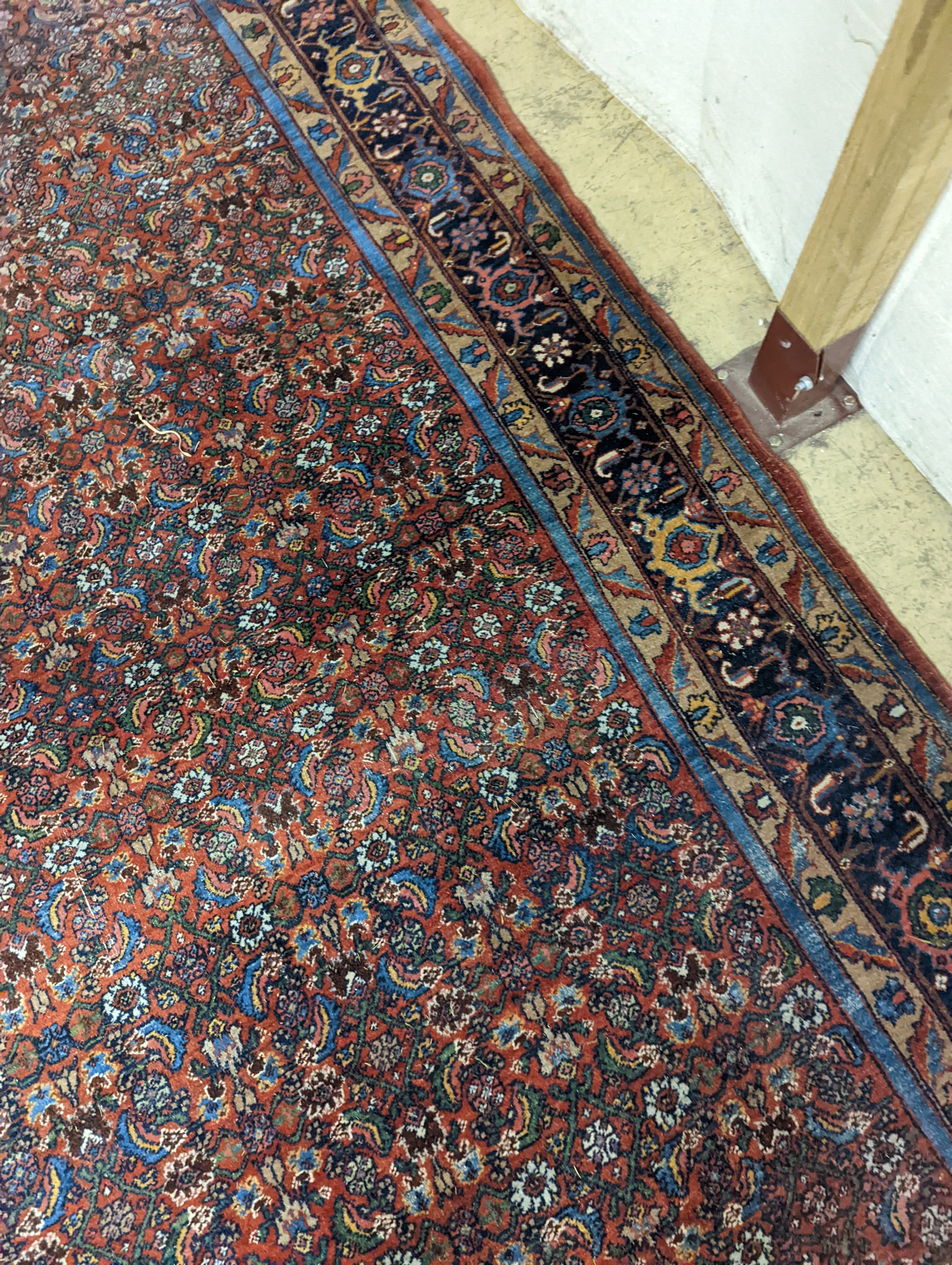 A North West Persian red ground carpet, 360 x 250cm
